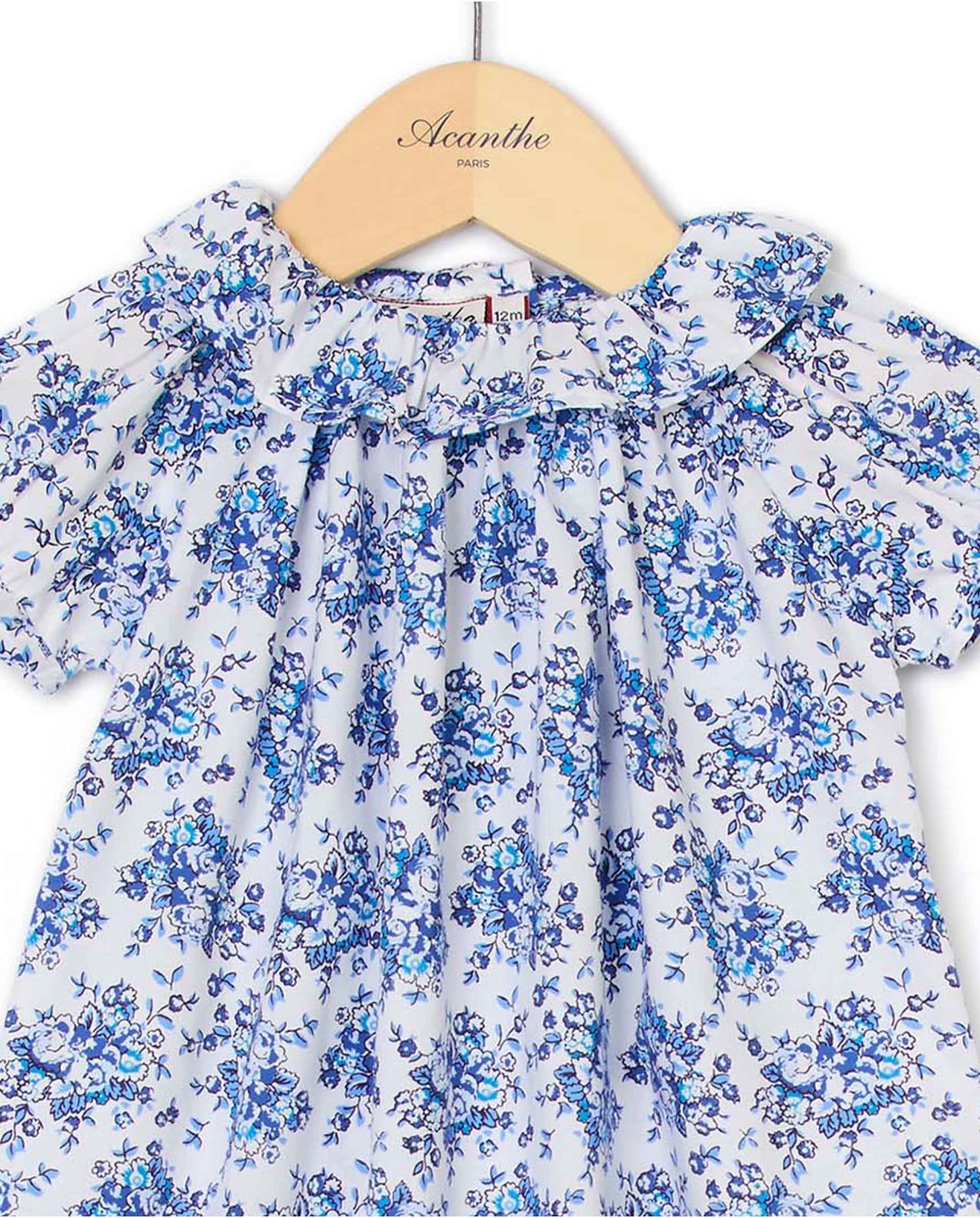 Barboteuse col volanté imprimé fleur bleue